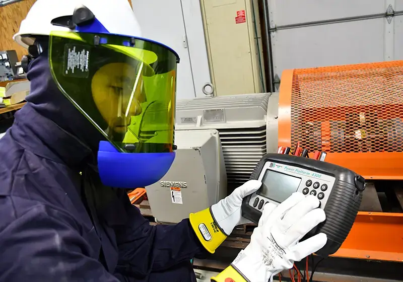 engineer testing equipment to help reduce demand charges