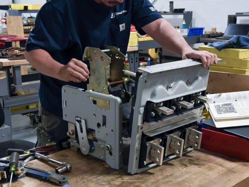 technician performing circuit breaker reconditioning