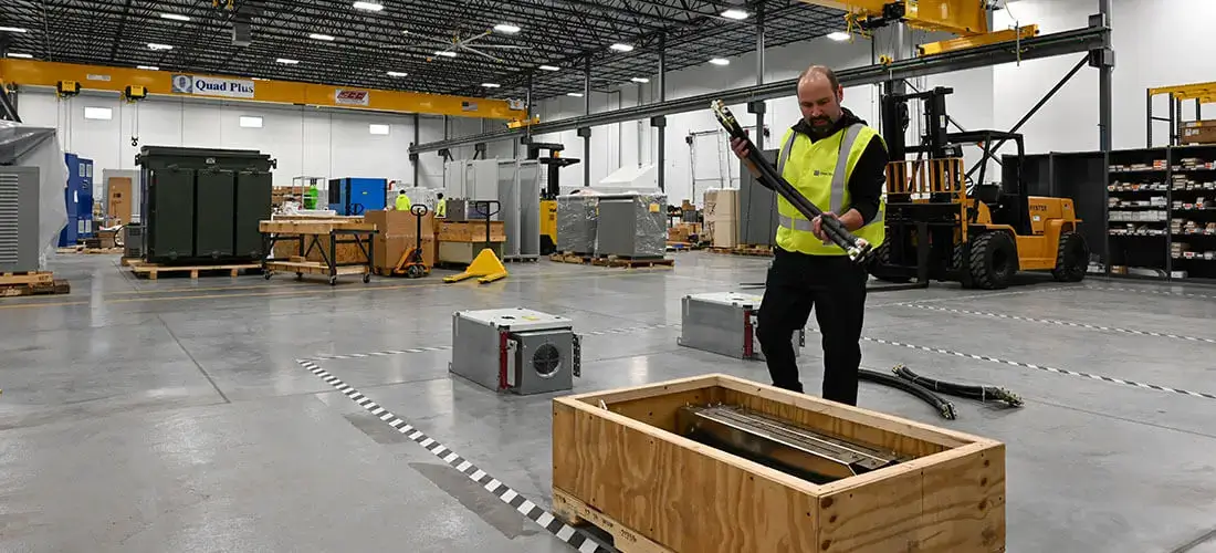 technician handling retrofit kit in workshop
